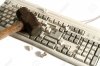 2645039-a-smashed-keyboard-with-hammer.jpg